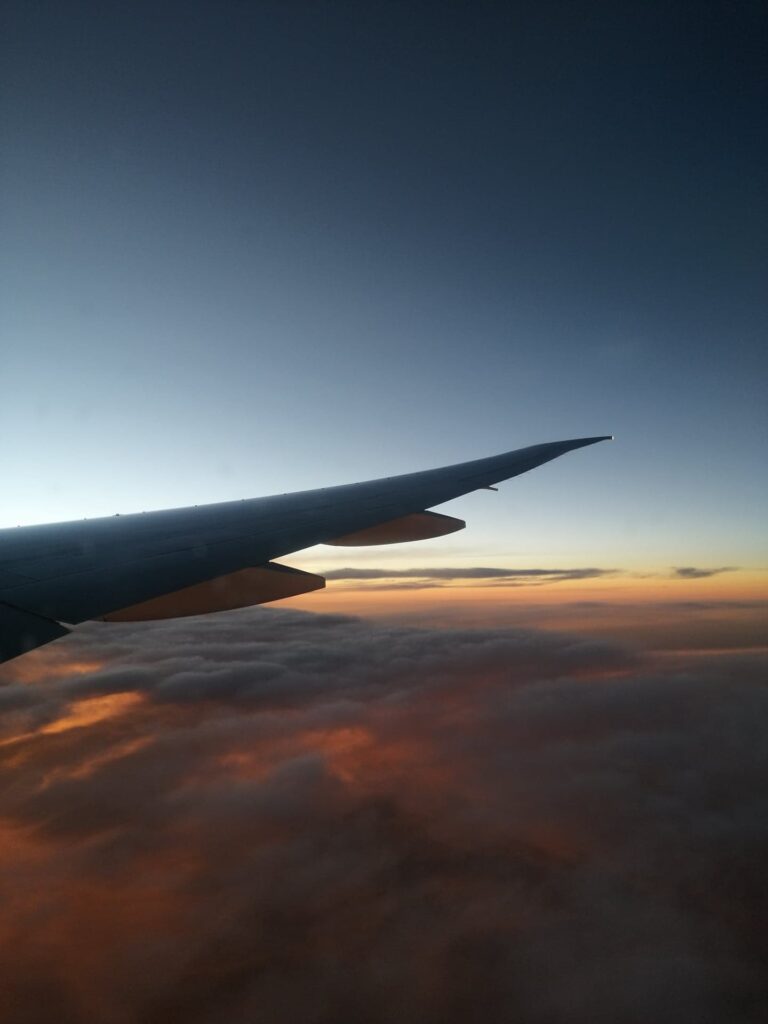 Wing at sunset with clouds