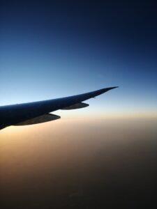 Airlplane wing at sunset seen from the airplane